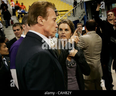 October 23, 2010 - Long Beach, California, U.S - Arnold Schwarzenegger  and Maria Shriver announced they are separating today after 25 years of marriage. . pictured: California Gov. Arnold Schwarzenegger  and Maria Shriver on October 23, 2010 as they greet volunteers during a tour of the Modern Hous Stock Photo