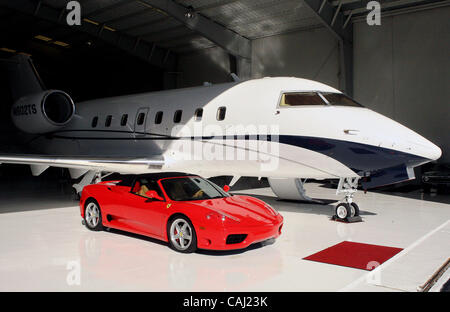 123107 sc biz planes  Photo by Damon Higgins/The Palm Beach Post    0047110A - Ft. Lauderdale - 2004 Ferrari 360 F1 Spider that goes for $205,000 parked adjacent to a 2008 Challenger 605 on sale for $35 million.  Aeoro Toy Store located in Ft. Lauderdale just west of I-95 on Cypress Creek Rd, sales  Stock Photo