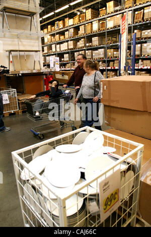 Subject: Ikea Man Lives in the Store Caption: Comedian and filmmaker MARK MALKOFF of Astoria, Queens, NY is living at the Ikea store in Paramus, New Jersey for one week while his apartment is fumigated. Here he continues his journey back to his 'apartment' relying on shopper-power to get  'home' fro Stock Photo