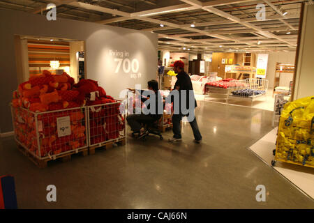 Subject: Ikea Man Lives in the Store Caption: Comedian and filmmaker MARK MALKOFF of Astoria, Queens, NY is living at the Ikea store in Paramus, New Jersey for one week while his apartment is fumigated. Here he finishes his journey back to his 'apartment' relying on shopper-power to get  'home' from Stock Photo