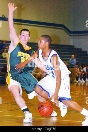 Sierra High basketball player Christian Williams drives the ball past Sonora's Matt Relei during their game at Sierra High on Wednesday, January 23, 2008 in Manteca, Calif.(Gina Halferty/San Joaquin Herald) Stock Photo