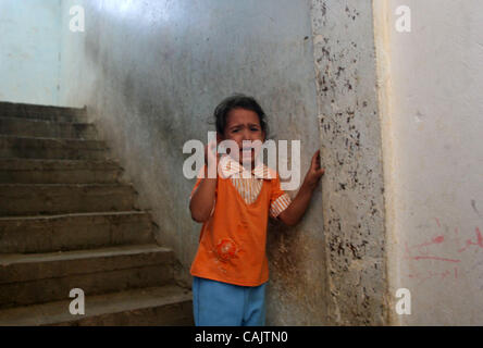 Sep 27, 2007 - Gaza City, Palestinian Territory - A Palestinian girl watches and cries during the funeral of Palestinians killed by Israeli troops, in the northern Gaza strip.The Israeli military killed two Palestinian militants in the Gaza Strip early today, bringing the death toll to 11 and one of Stock Photo