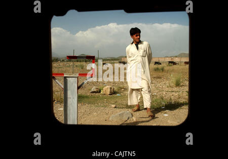 Sep 27, 2007 - Bak, Khost, Afghanistan - Photos taken through side window of US Army Humvee. Afghan man stands and watches a convoy of Humvees leave the Bak district center in Bak (Credit Image: © Andrew Craft/The Fayetteville Observer/ZUMA Press) Stock Photo