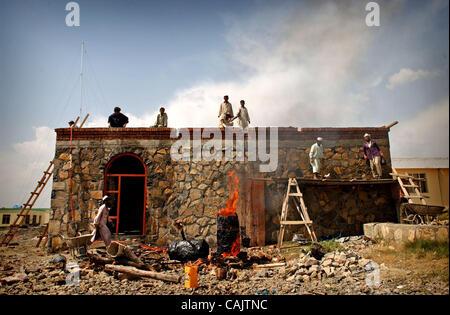 Sep 27, 2007 - Bak, Khost, Afghanistan - Afghans work on a building at the Bak district center that will serve as a base of operations for the 82nd Airborne Division in Bak. (Credit Image: © The Fayetteville Observer/Andrew Craft/ZUMA Press) Stock Photo