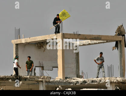 Oct 01, 2007 - Gaza City, Palestinian Territories - Palestinians wave yellow Fatah flags as they wait for relatives released from Israeli prisons, at the Erez crossing, northern Gaza Strip. Israel was to release 87 Palestinian prisoners today as a goodwill gesture to president Mahmud Abbas during th Stock Photo