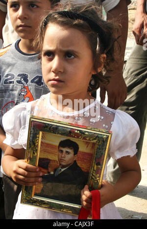 Oct 01, 2007 - Gaza City, Palestinian Territories - Relatives of Palestinians jailed in Israel wait near the Erez border crossing between the Gaza Strip and Israel. Israel was expected to free 30 Palestinian prisoners in the Gaza Strip on Monday, but the release was delayed. Officials gave no explan Stock Photo