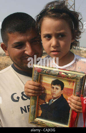 Oct 01, 2007 - Gaza City, Palestinian Territories - Relatives of Palestinians jailed in Israel wait near the Erez border crossing between the Gaza Strip and Israel. Israel was expected to free 30 Palestinian prisoners in the Gaza Strip on Monday, but the release was delayed. Officials gave no explan Stock Photo