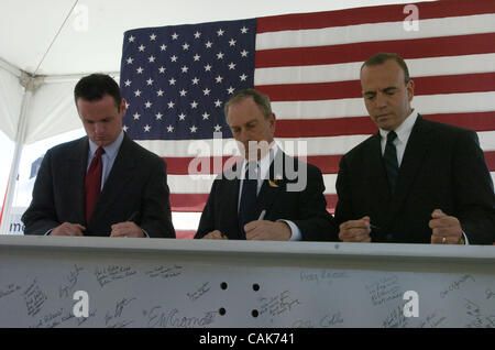 PIttsburgh Mayor Luke Ravenstahl (L) Mayor Michael Bloomberg (C) and Allegheny County Chief Executive Dan Onorato (R) sign the steel beam touring the country. In a press conference at PNC Park National September 11 Memorial and Museum Chairman and New York City Mayor Michael Bloomberg announces two  Stock Photo
