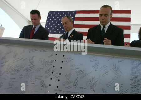 PIttsburgh Mayor Luke Ravenstahl (L) Mayor Michael Bloomberg (C) and Allegheny County Chief Executive Dan Onorato (R) sign the steel beam touring the country. In a press conference at PNC Park National September 11 Memorial and Museum Chairman and New York City Mayor Michael Bloomberg announces two  Stock Photo