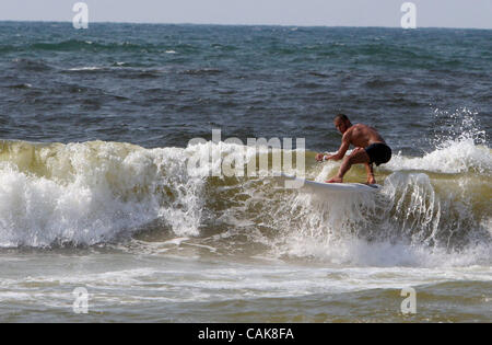 Sep 25, 2007 - Gaza City, Palestinian Territories - Palestinian youths surf at the beach near Gaza City in the northern Gaza Strip. Sunday, Sept. 25, 2007. American surfer Dorian Paskowitz donated 12 surfboards in August, 2007, saying he believes surfing can bring peace to Israelis and Palestinians. Stock Photo