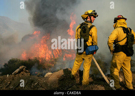 September 15, 2007, Julian, California, USA A firefighter sets a ...