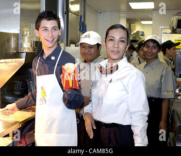 Nov. 20, 2003 - Los Angeles, USA - Actor Justin Berfield, co-star of the tv show, ''Malcolm in the Middle'' gets the scoop on how to supersize the fries during a celebrity visit to McDonald's, all part of World Children's Day as celebrated in Los Angeles. (Credit Image: Â© Brian Cahn/ZUMAPRESS.com) Stock Photo