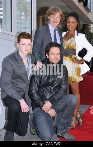 Cameron Monaghan, Justin Chatwin, William H. Macy, Shanola Hampton at the induction ceremony for Stars on the Hollywood Walk of Fame for William H. Macy and Felicty Huffman, Hollywood Boulevard, Los Angeles, CA March 7, 2012. Photo By: Michael Germana/Everett Collection Stock Photo