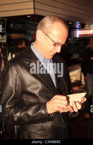 Status Quo's Francis Rossi visits music shop in Croydon 7 months after it was looted during the London Riots in August 2011 Stock Photo