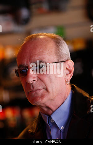 Status Quo's Francis Rossi visits music shop in Croydon 7 months after it was looted during the London Riots in August 2011 Stock Photo