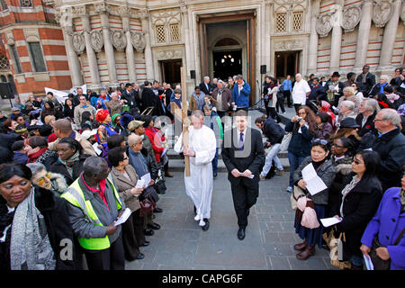 London, UK. 06 April, 2012. Carrying the Cross at Westminster Cathedral during the Good Friday Procession of Witness in London. The procession made its way from Methodist Central Hall, to Westminster Cathedral then to Westminster Abbey in London. Stock Photo