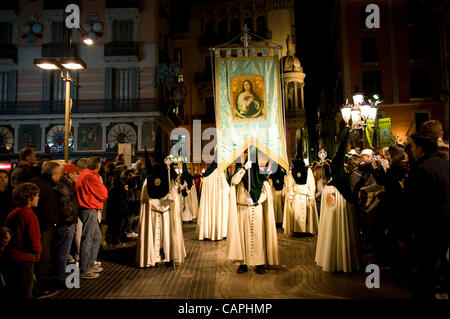 06 april, 2012-Barcelona, Spain. The streets of the old part of Barcelona are the backdrop for the procession of Good Friday, Easter. By the Real Hermandad de Jesús del Gran Poder y María Santísima de la Esperanza Macarena it begins and finish at Sant Agusti's church (Image credit ©Jordi Boixareu) . Stock Photo