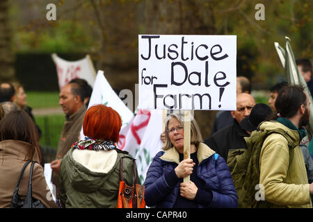 London, UK. 08/04/2012. A supporter holds a 'Justice for Dale Farm' placard, the traveller site recently evicted in Essex. 8th April marks Roma Nation Day. Stock Photo