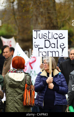 London, UK. 08/04/2012. A supporter holds a 'Justice for Dale Farm' placard, the traveller site recently evicted in Essex. 8th April marks Roma Nation Day. Stock Photo
