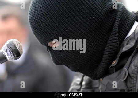 April 09, 2012 - Londonderry, Northern Ireland, UK - A masked member of the Real IRA reads an Easter message during the dissident republican 32 County Sovereignty Movement's commemoration of the 1916 Easter Rising. Stock Photo