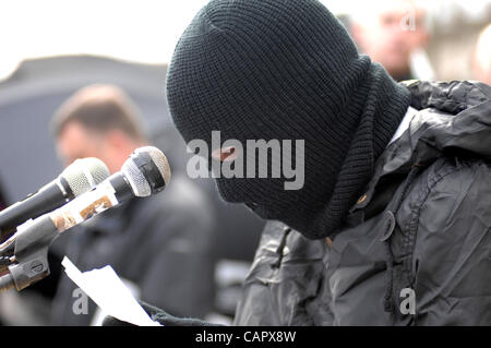 April 09, 2012 - Londonderry, Northern Ireland, UK - A masked member of the Real IRA reads an Easter message during the dissident republican 32 County Sovereignty Movement's commemoration of the 1916 Easter Rising. Stock Photo