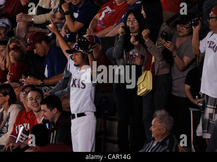 A newly-joined Texas Rangers Yu Darvish (L) shakes hands with his Iranian  father, Farsad Darvishsefad at Rangers Ballpark in Arlington, Texas, on  Jan. 21, 2012. The right-hand Japanese ace Darvish agreed to