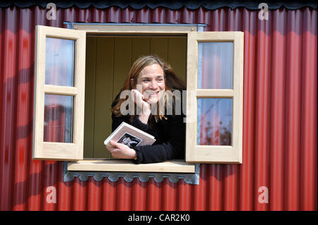 Author Tracy Chevalier in a Plankbridge shepherd hut, UK Stock Photo