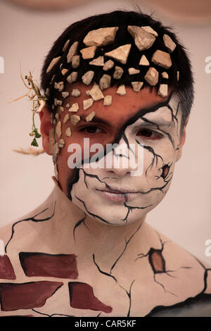 Young man with painted face during bodypainting festival in Tel Aviv on 11 April 2012. Bodypainters converged in Tel Aviv for the First International Bodypainting. Stock Photo