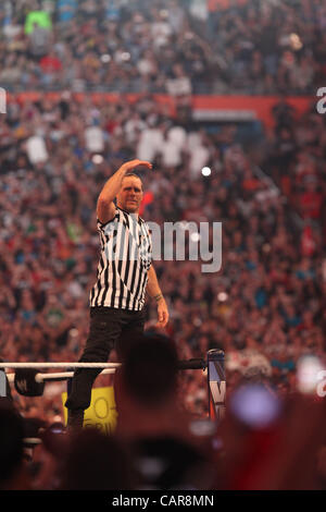 WWE legends The Undertaker wrestled Triple H at Wrestlemania 28 in Miami, FL at Sun Life Stadium. WWE Hall of Famer Shawn Michaels served as the special referee. The Undertaker won, advancing his streak to 20-0 at Wrestlemania events. Stock Photo