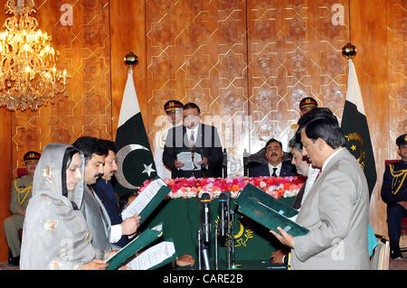 President, Asif Ali Zardari administers oath to the State Ministers during oath taking ceremony held at Aiwan- e- Sadr in Islamabad on Friday, April 13, 2012. Prime Minister, Syed Yousuf Raza Gilani also present on this occasion Stock Photo