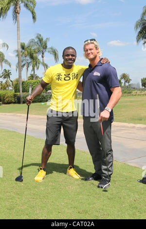 WWE Superstar Dolph Ziggler poses with UFC star Melvin Gillard at the WWE charity Pro-Am golf tournament at the Doral Country Club in Miami, FL. Stock Photo