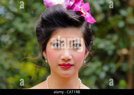 Wimbledon, London, UK, 15 April 2012.  At the Thai temple of Wat Buddhapadipa to celebrate Songkran, Thai New Year, a contestant in the Miss Songkran beauty contest poses for a photo. Stock Photo