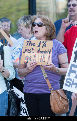 Members of the Communications Workers of America (CWA Local 1103) and MoveOn participate in the Tax the 1% protest at the post office in White Plains, New York, USA on Tuesday, April 17, 2012.  The protest focused on the imbalance of taxation of the middle class vs corporations and the wealthy. Stock Photo