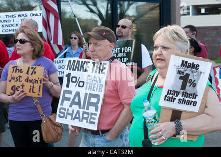 Members of the Communications Workers of America (CWA Local 1103) and MoveOn participate in the Tax the 1% protest at the post office in White Plains, New York, USA on April 17, 2012.  The protest focused on the imbalance of taxation of the middle class vs corporations and the wealthy. Stock Photo