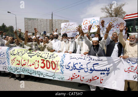 Members of WAPDA Hydro Electric Central Labor Union chant slogans against price-hiking and in favor of their demands during protest demonstration in Peshawar on Wednesday, April 18, 2012. Stock Photo