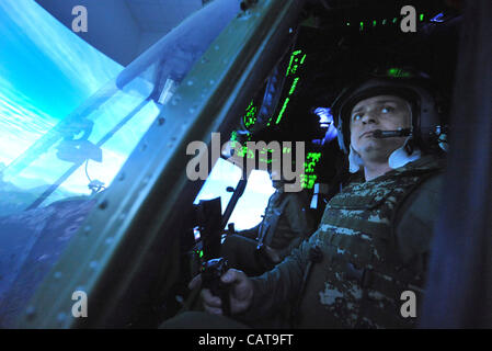 Czech and Croatian helicopter crews undergo training on flight simulator ahead their deployment in ISAF mission in Afghanistan. Czech pilot Josef korinek during training programme at the Mosnov Airport, Ostrava on April 18, 2012. (CTK Photo/Jaroslav Ozana) Stock Photo