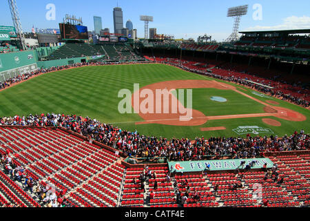 Boston, Massachusetts, USA. April 19, 2012. Thousands of Red Sox fans surround the ballfield in Fenway Park on its 100th Anniversary Open House Celebration.