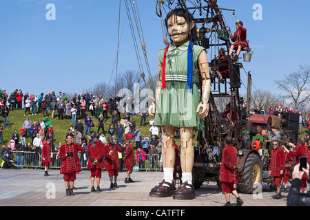 Liverpool, UK, Friday 20th April, 2012. The giant little girl puppet starts her walk around the city on the first of a 3 day event 'Sea Odyssey-Giant Spectacular'. The event helps to commemorate the sinking of the Titanic’s 100 year anniversary. Stock Photo
