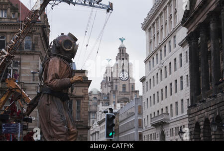 Liverpool, UK, Friday 20th April, 2012. The giant uncle puppet starts his walk with the Liver building behind on the first of a 3 day event 'Sea Odyssey-Giant Spectacular'. The event helps to commemorate the sinking of the Titanic’s 100 year anniversary. Stock Photo