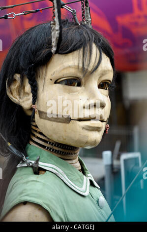 Liverpool, UK. 20 April, 2012. A giant puppet of a girl walks through Liverpool. The event is part of Liverpool's commemorations for the recent 100th anniversary of the sinking of the Titanic. Stock Photo