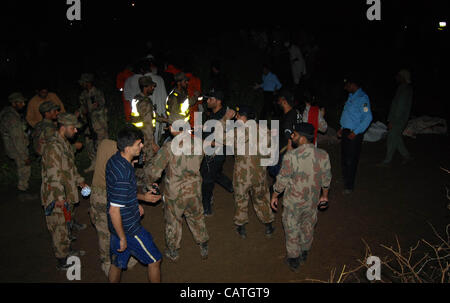 Islamabad, Pakistan, April 20, 2012: Soldiers working at the site of the plane crash near Pakistan's capital city of Islamabad that killed all 127 passengers and crew members. Stock Photo