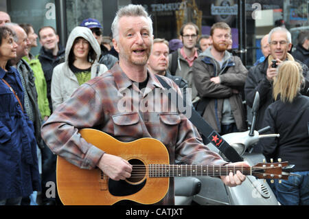 Billy Bragg performs on the street outside Sister Ray record store in Berwick Street, Soho as part of the event 'Record Store Day' to promote independent specialist record shops. 21st April 2012. Stock Photo