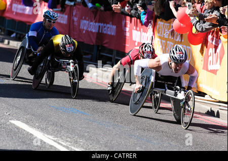 Wheelchair athletes cross Tower Bridge competing in the London Marathon   on 22 April 2012. Picture by Julie Edwards Stock Photo