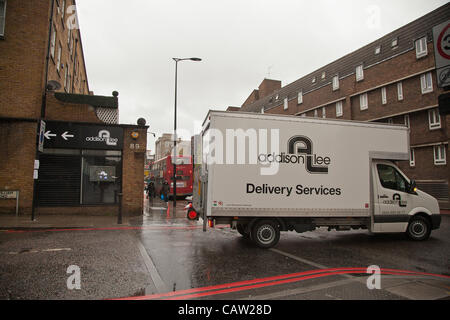 LONDON, UK, 23rd, Apr, 2012 A van from Addison Lee passes the site of their offices as cyclists gathered outside the Addison offices to protest against the recent comments by the chairman, who claimed they are “throwing themselves onto (the road)” and that training is urgently required, along with i Stock Photo