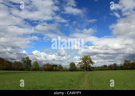 The skies finally clear after the April showers continue across Britain, at Tolworth Court Farm, green belt land in South West London, England, UK Stock Photo