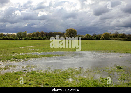 As the April showers continue across Britain, more stormy weather and flooded fields at Tolworth Court Farm, green belt land in South West London, England, UK Stock Photo