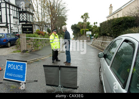 British Police officer talks to member of public Stock Photo