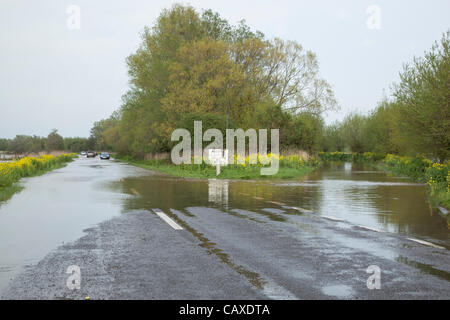 Cars pass through flood water on the main A361 from Taunton to Glastonbury near Athelney on 2 May 2012 . The road and layby were closed briefly as it became impassable due to the continuous rain which has caused widespread flooding across the Somerset Levels despite the official drought declaration. Stock Photo