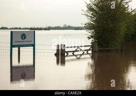 Environment Agency sign for Curry Moor Pumping Station submerged by flood water on Cuts Road at Athelney on 2 May 2012 . The road has been closed due to the continuous rain which has caused widespread flooding across the Somerset Levels despite the official drought declaration. Stock Photo