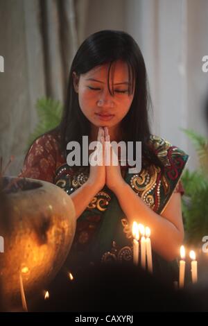 May 6, 2012 - Dhaka, Bangladesh - 06 May 2012. Dhaka,Bangladesh- The Buddhist community celebrates Budda Purnima by performing special worship & light candle paper  at the Old part of Dhaka Bashabo Buddhist Temple. The day marks Gautam Buddha's birth, enlightenment and death. It falls on the day of  Stock Photo